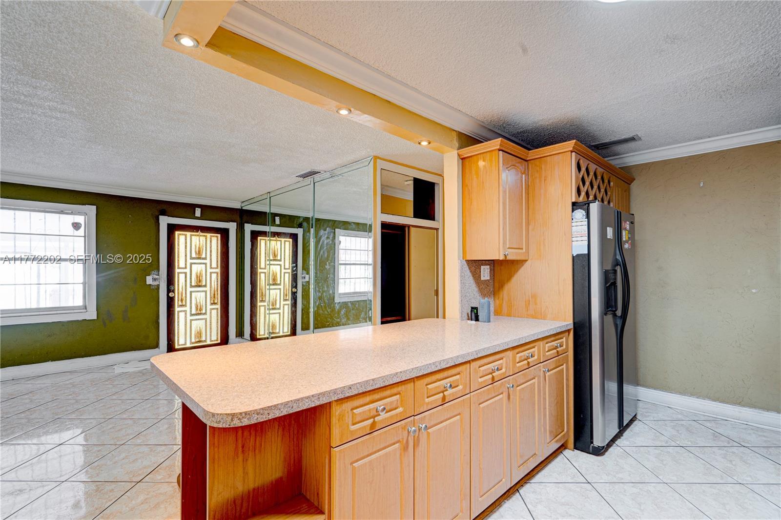 390 East 44th Street Hialeah, FL 33013 - Photo 8 of 39 a bathroom with a granite countertop sink and a large mirror