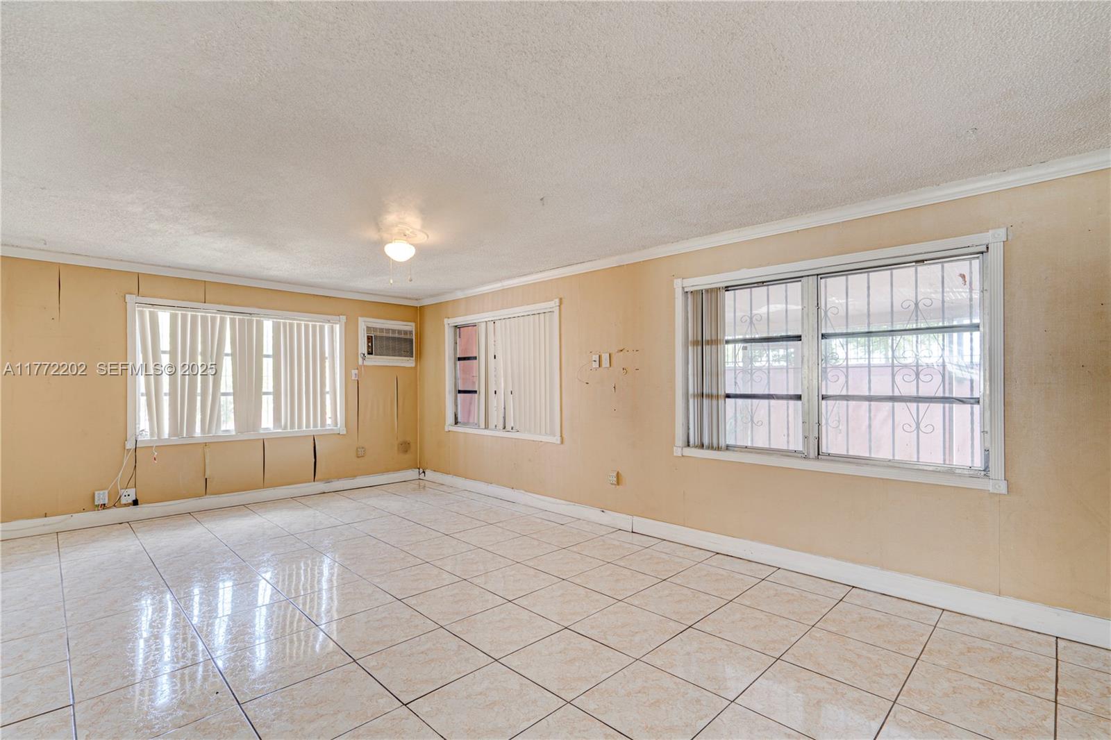 390 East 44th Street Hialeah, FL 33013 - Photo 10 of 39 a view of an empty room with a window