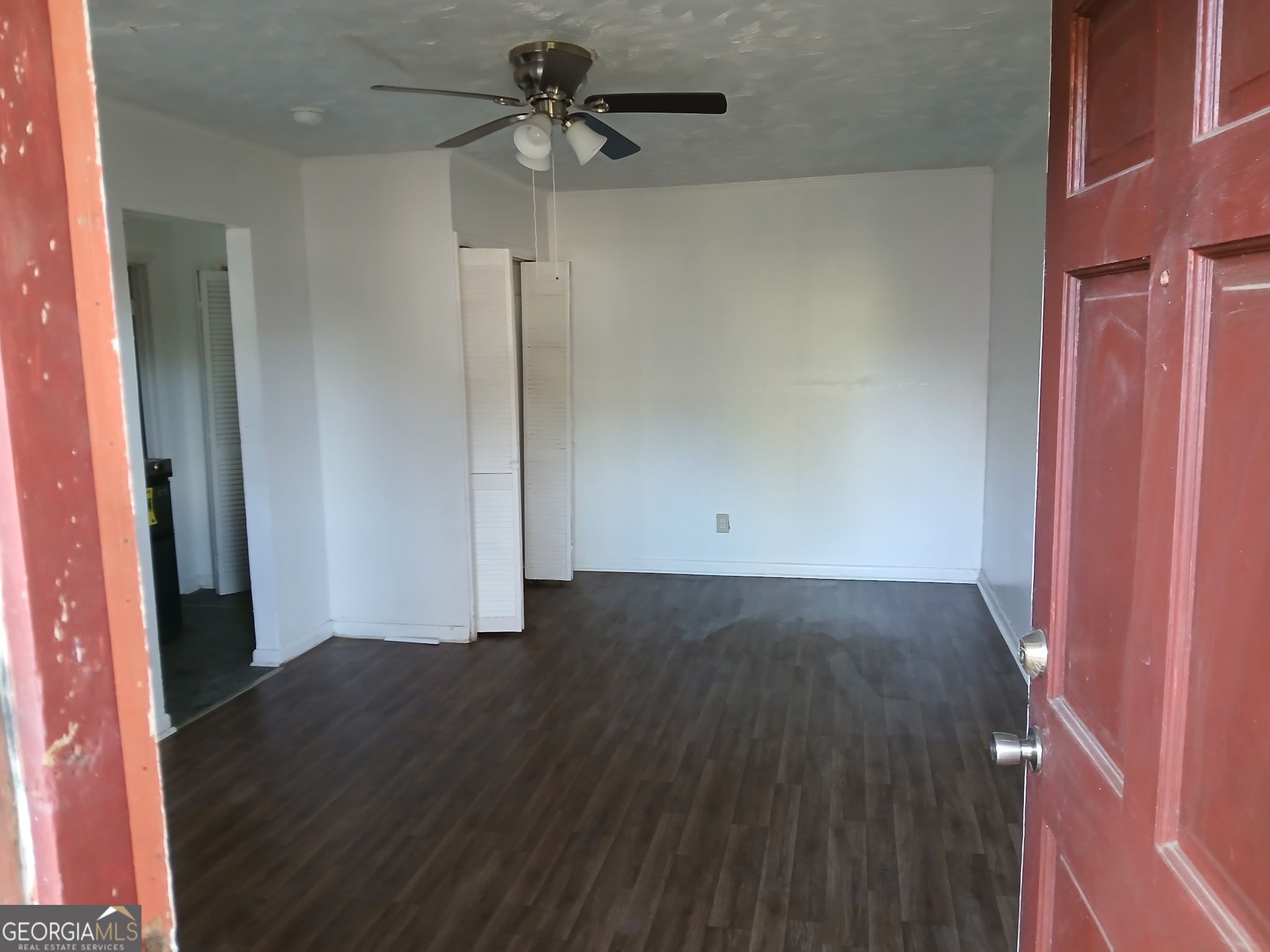 218 A Hunt Street Fort Valley, GA 31030 - Photo 2 of 8 wooden floor in an empty room