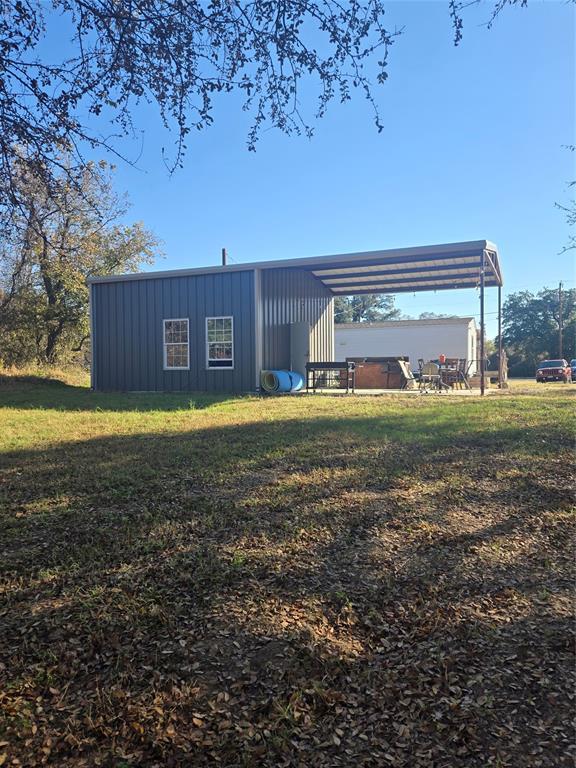 1021 Riverview Road Millsap, TX 76066 - Photo 5 of 26 View of outdoor structure featuring a carport