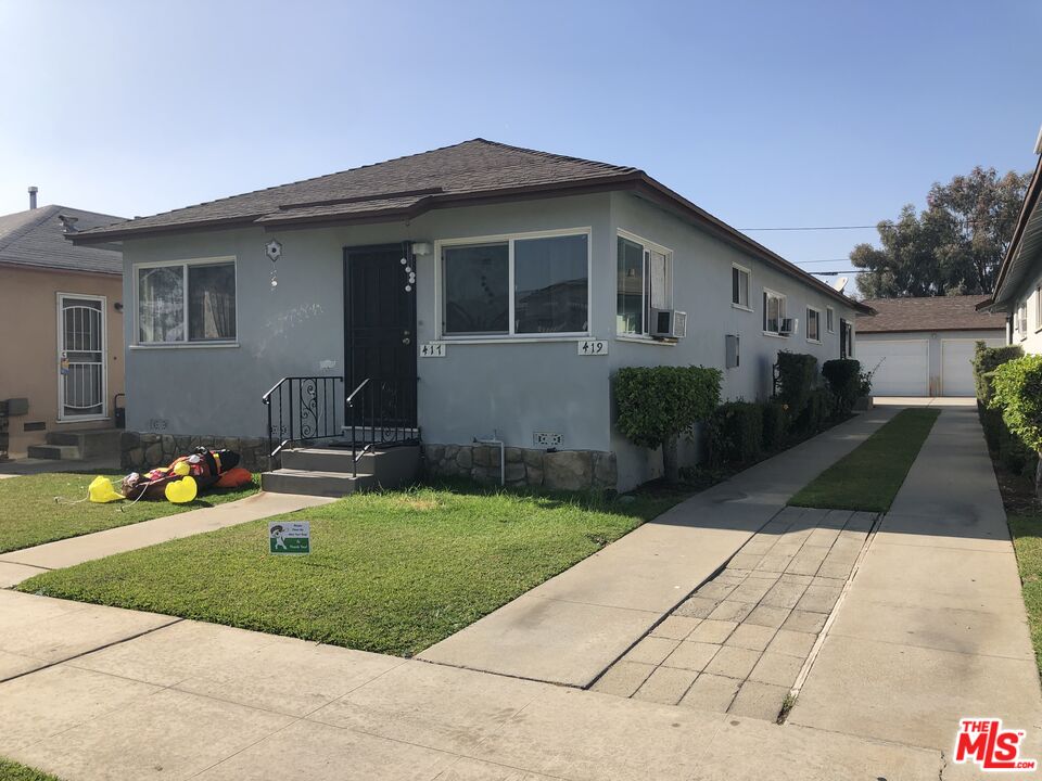417 North 7th Street Montebello, CA 90640 - Photo 2 of 6 a house view with a garden space