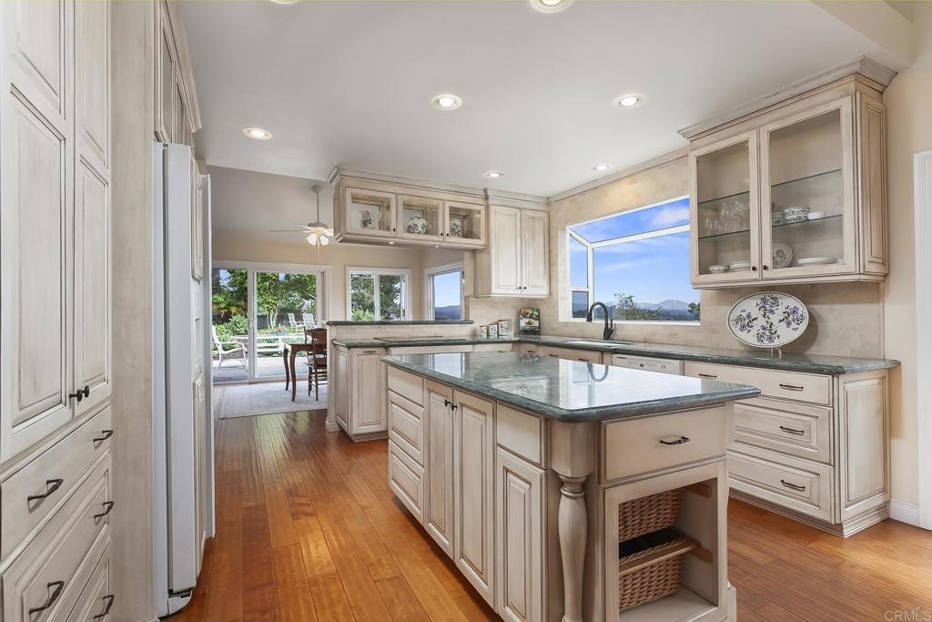 747 Santa Victoria Solana Beach, CA 92075 - Photo 21 of 57 a kitchen with stainless steel appliances granite countertop a stove and a sink