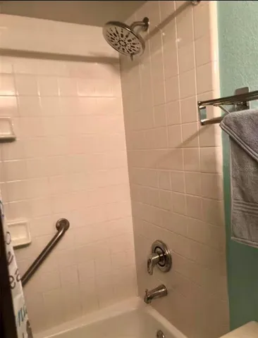 a bathroom with a shower and a bathtub