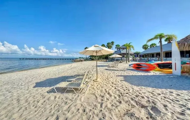 a view of swimming pool with outdoor seating