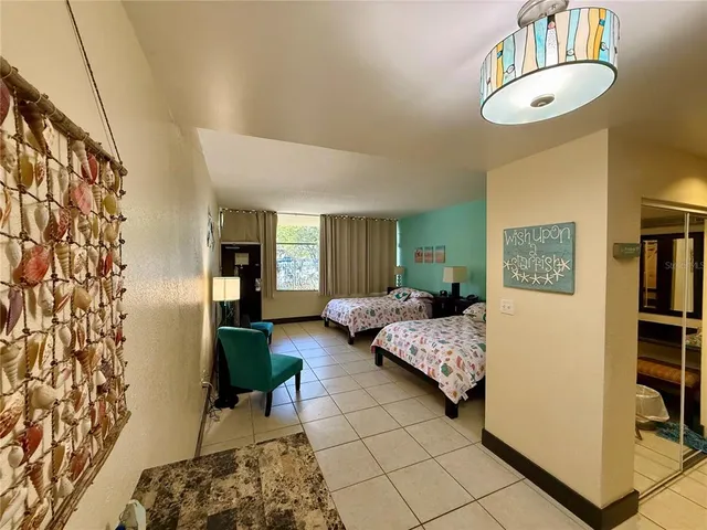 a bedroom with double bed and a window