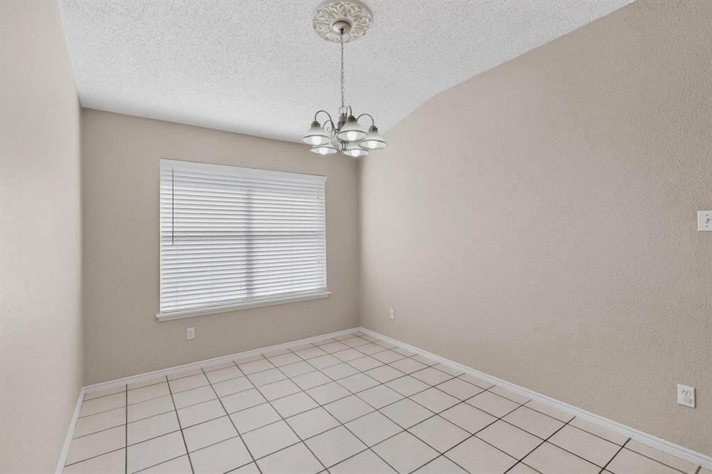 1207 Aberdeen Drive Allen, TX 75002 - Photo 19 of 40 a view of an empty room with a window