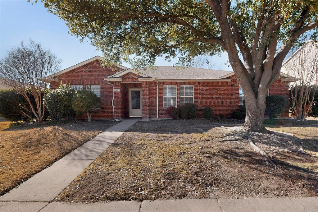 1207 Aberdeen Drive Allen, TX 75002 - Photo 2 of 40 a front view of a house with a yard and garage