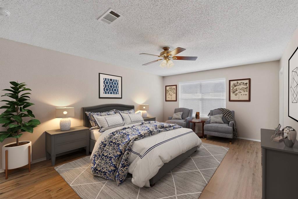 1207 Aberdeen Drive Allen, TX 75002 - Photo 23 of 40 a bedroom with a bed a couch and potted plant with the dresser