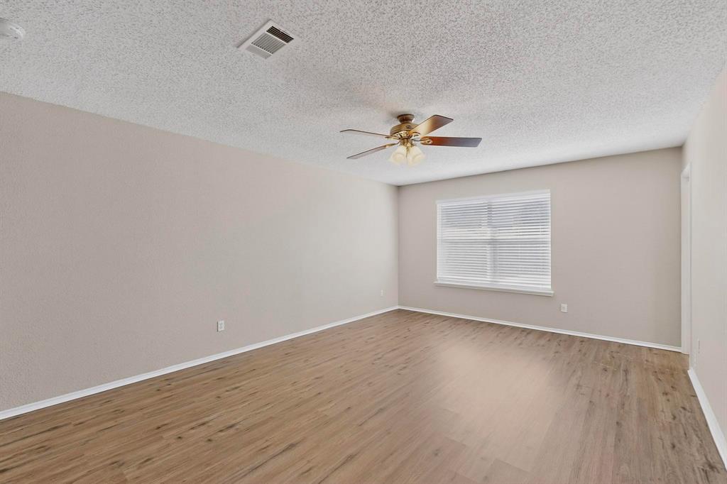 1207 Aberdeen Drive Allen, TX 75002 - Photo 24 of 40 wooden floor in an empty room with a window