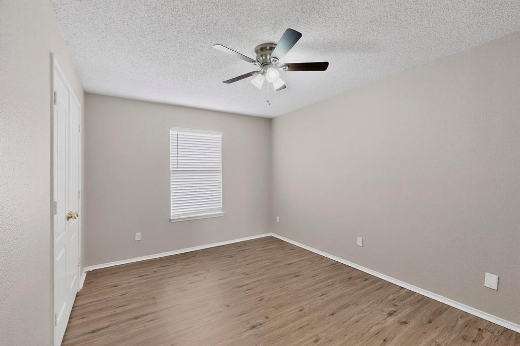 1207 Aberdeen Drive Allen, TX 75002 - Photo 29 of 40 wooden floor in an empty room with a window
