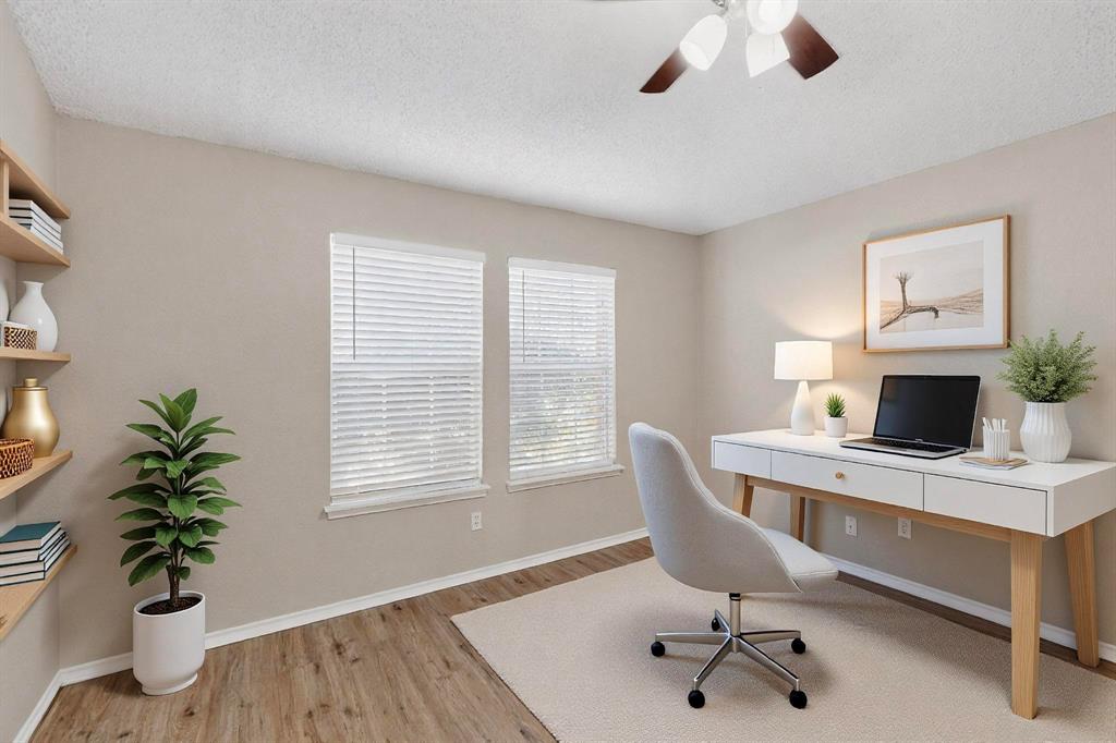 1207 Aberdeen Drive Allen, TX 75002 - Photo 31 of 40 a workspace with furniture and a potted plant