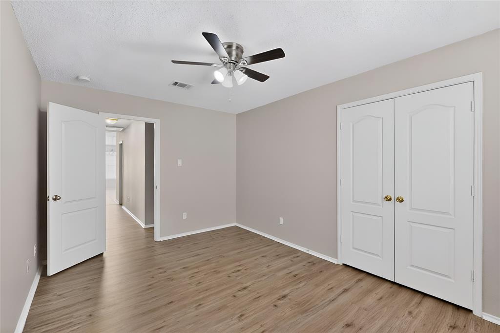 1207 Aberdeen Drive Allen, TX 75002 - Photo 32 of 40 a view of an empty room with wooden floor