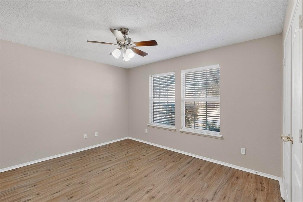 1207 Aberdeen Drive Allen, TX 75002 - Photo 33 of 40 a view of an empty room with wooden floor and a window