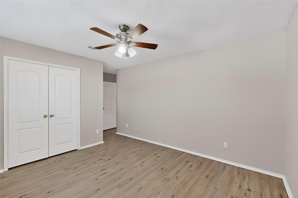1207 Aberdeen Drive Allen, TX 75002 - Photo 34 of 40 a view of an empty room with wooden floor and closet