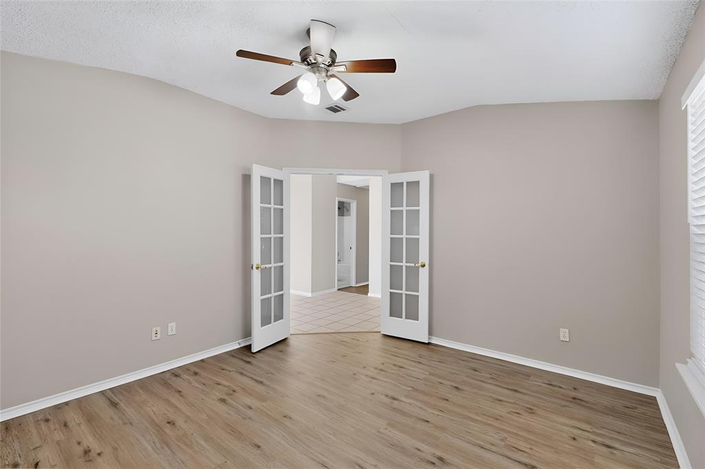 1207 Aberdeen Drive Allen, TX 75002 - Photo 36 of 40 wooden floor in an empty room with a window