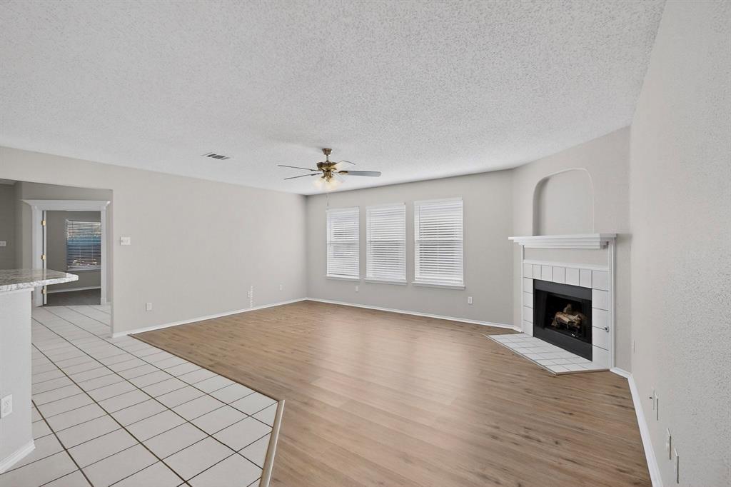 1207 Aberdeen Drive Allen, TX 75002 - Photo 7 of 40 wooden floor fireplace and natural light in room