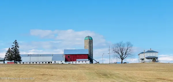 a view of an ocean with a building in the background