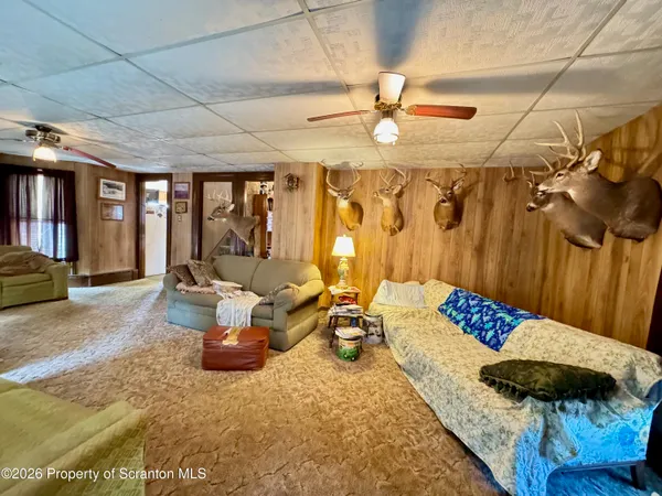 a view of a livingroom with furniture and a rug