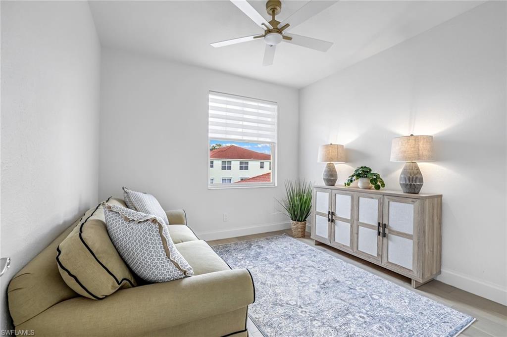 630 Lalique Circle, Unit 506 Naples, FL 34119 - Photo 18 of 25 a living room with furniture and a window