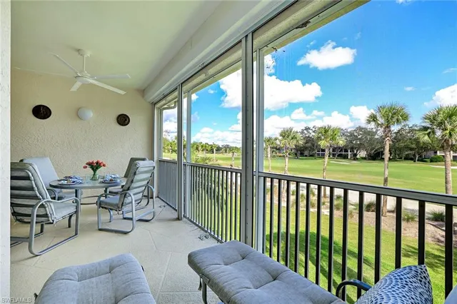 a balcony with chairs and a swing chair