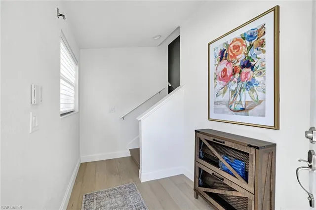 a view of an entryway with wooden floor