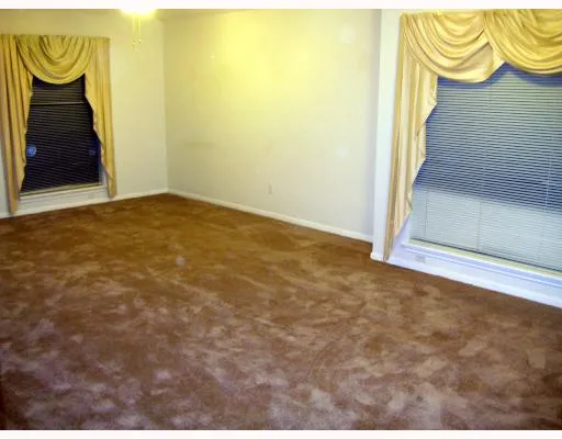 a view of an entryway door with wooden floor