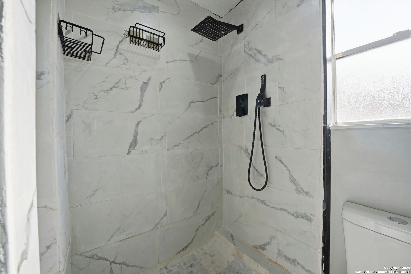 126 Meadow Way Converse, TX 78109 - Photo 20 of 33 a bathroom with a shower