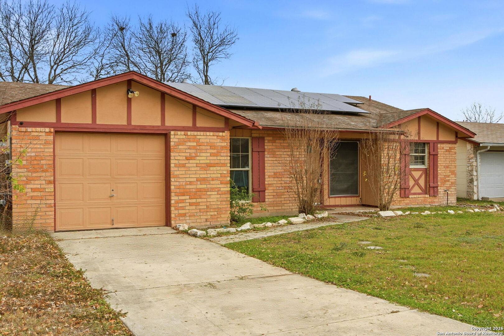 126 Meadow Way Converse, TX 78109 - Photo 2 of 33 a front view of a house with a yard