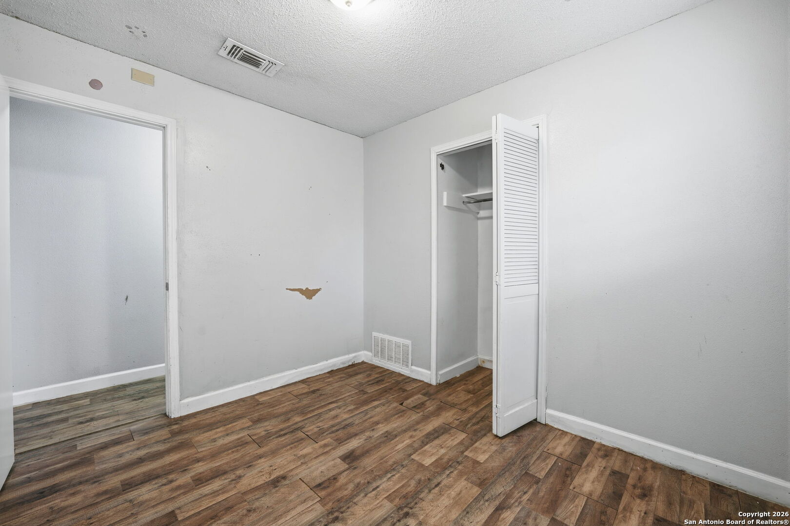 126 Meadow Way Converse, TX 78109 - Photo 24 of 33 a view of room with wooden floor