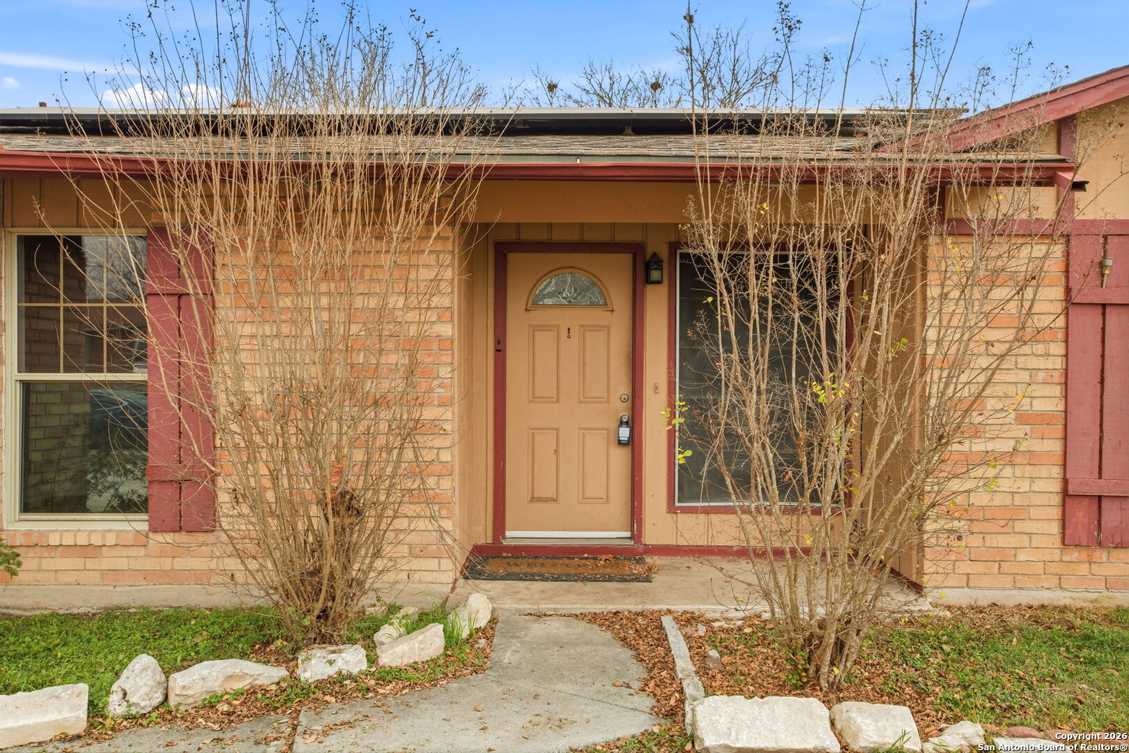 126 Meadow Way Converse, TX 78109 - Photo 3 of 33 a front view of a house with a yard and garage