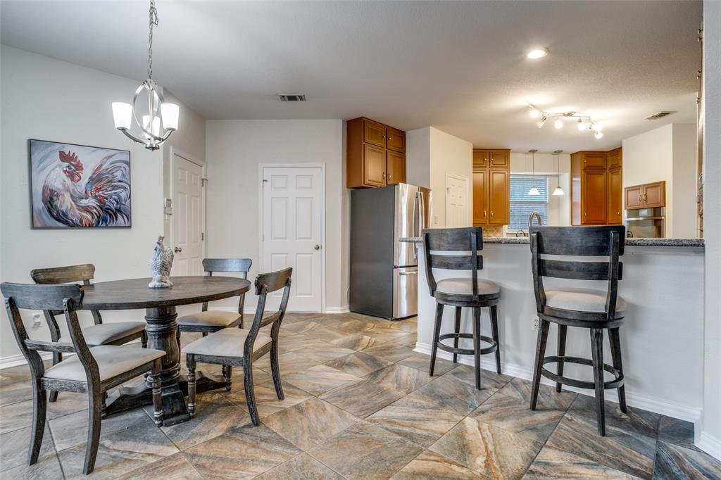 411 Wolverley Lane Allen, TX 75002 - Photo 11 of 27 a view of a dining room with furniture