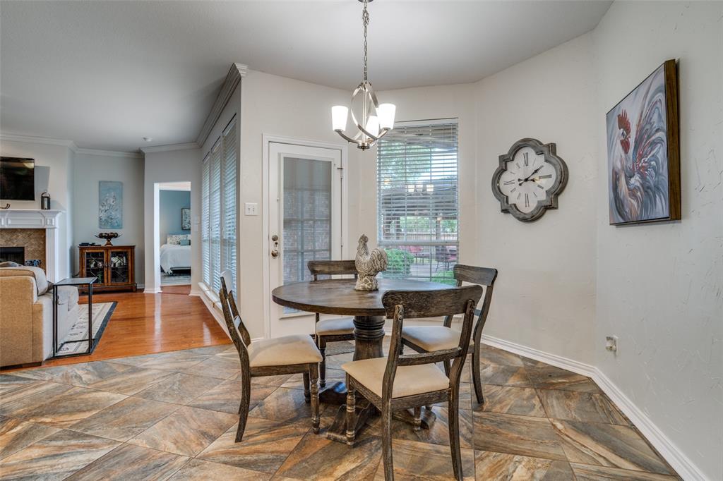 411 Wolverley Lane Allen, TX 75002 - Photo 12 of 27 a view of a dining room with furniture a chandelier and wooden floor