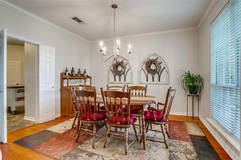 411 Wolverley Lane Allen, TX 75002 - Photo 15 of 27 a view of a dining room with furniture and wooden floor