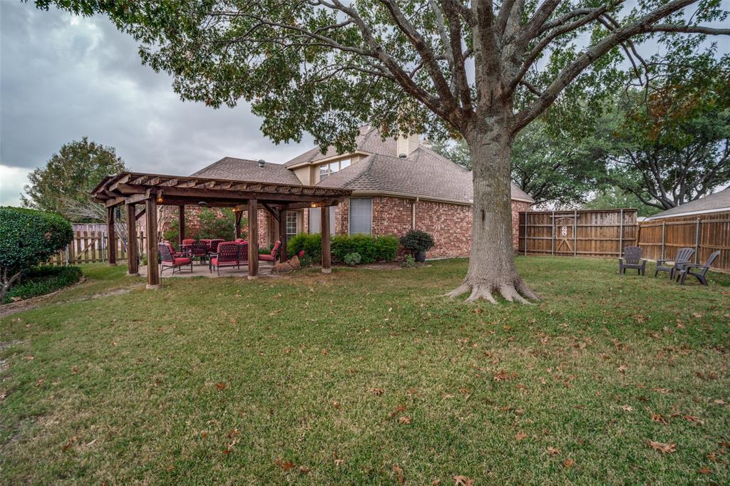 411 Wolverley Lane Allen, TX 75002 - Photo 2 of 27 a front view of a house with garden