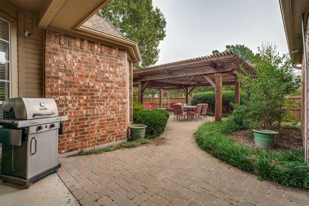 411 Wolverley Lane Allen, TX 75002 - Photo 24 of 27 a view of a patio with table and chairs and potted plants