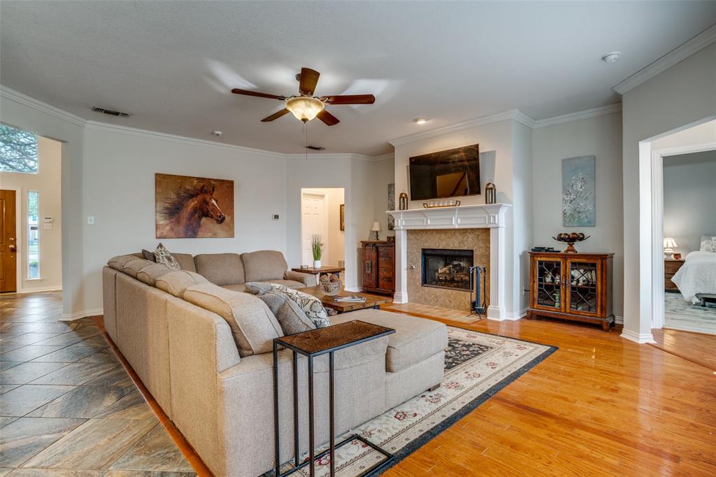 411 Wolverley Lane Allen, TX 75002 - Photo 3 of 27 a living room with furniture and a fireplace
