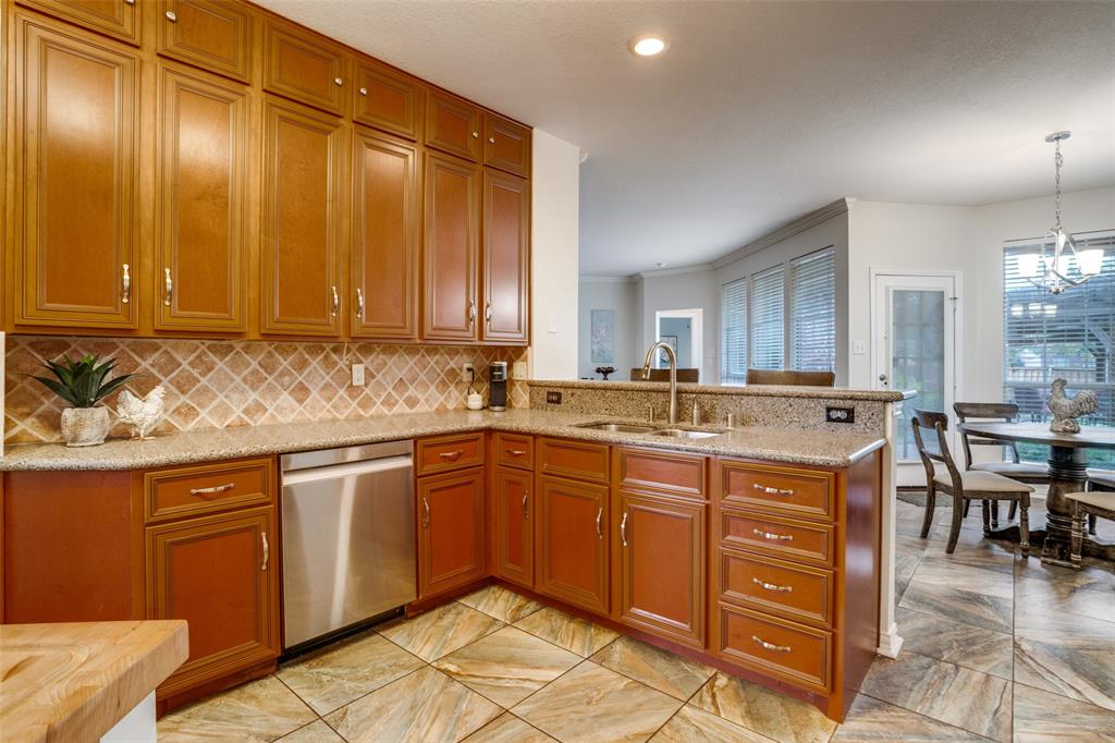 411 Wolverley Lane Allen, TX 75002 - Photo 4 of 27 a kitchen with a sink and cabinets