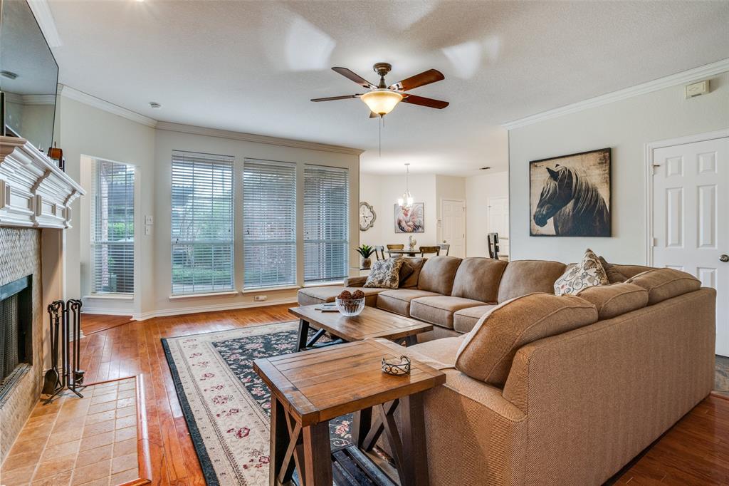 411 Wolverley Lane Allen, TX 75002 - Photo 8 of 27 a living room with furniture and a fireplace