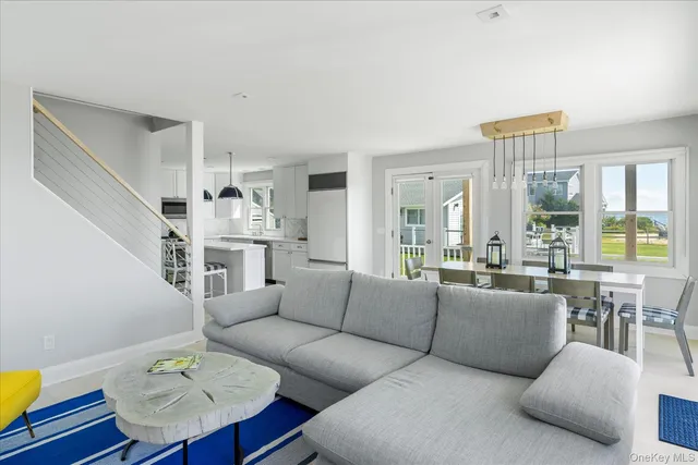 a living room with furniture fireplace and a table