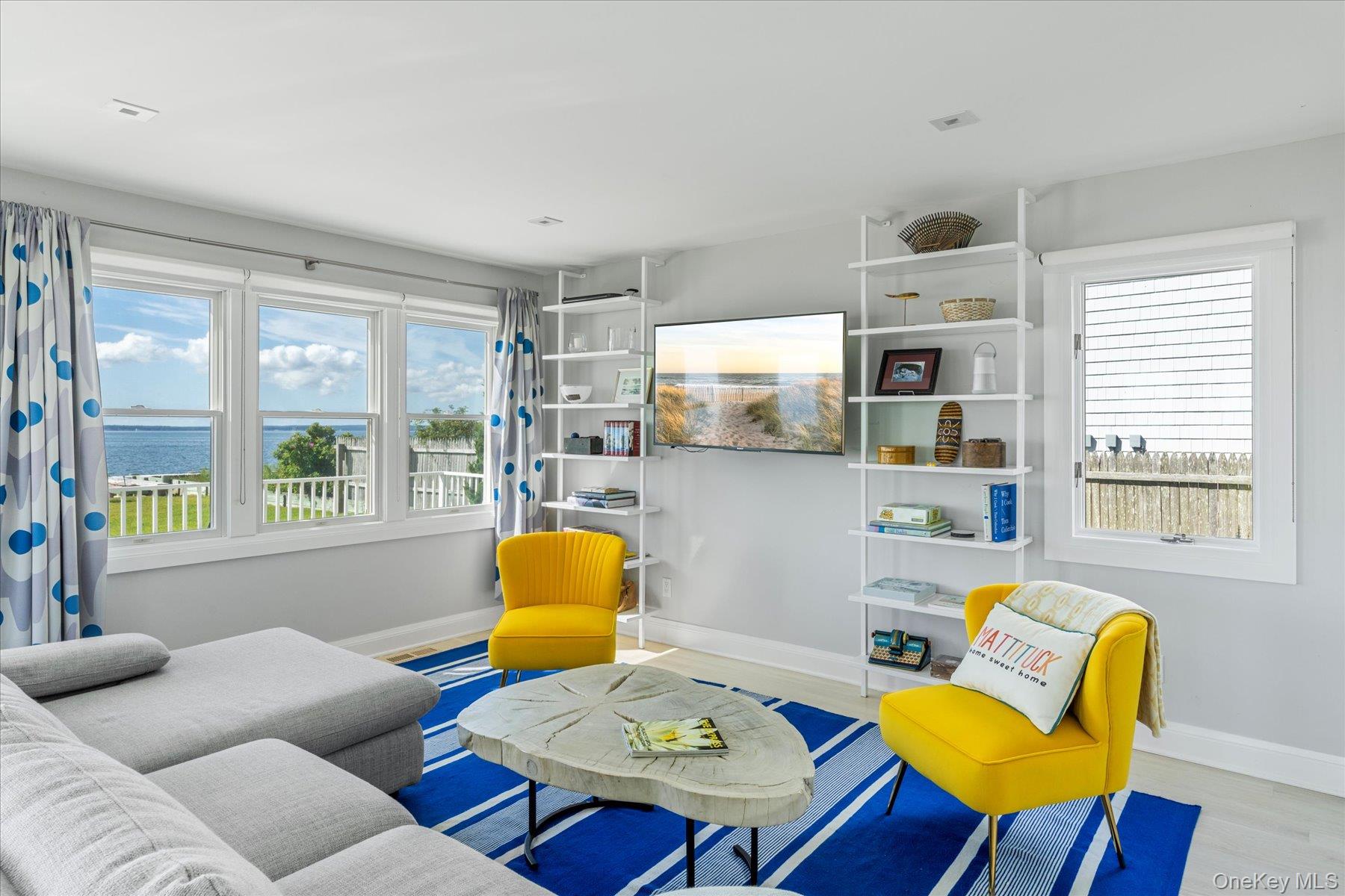 4415 Camp Mineola Road Mattituck, NY 11952 - Photo 11 of 44 a living room with furniture and a window