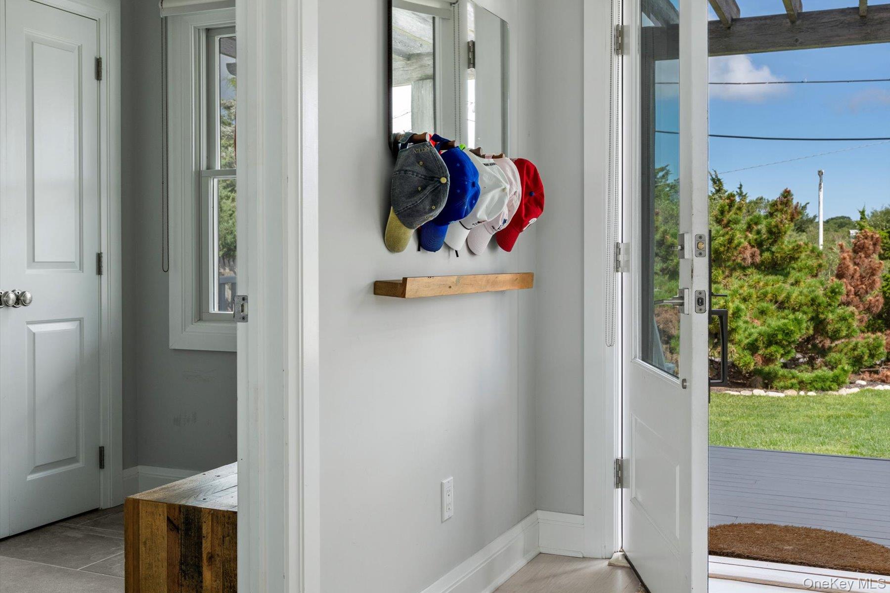 4415 Camp Mineola Road Mattituck, NY 11952 - Photo 15 of 44 Inviting entry opens to light-filled, open concept main living.