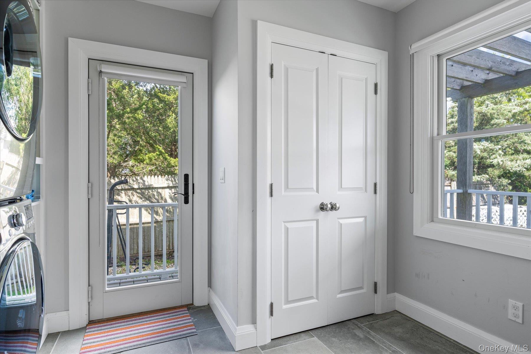 4415 Camp Mineola Road Mattituck, NY 11952 - Photo 15 of 44 a view of front door with wooden floor