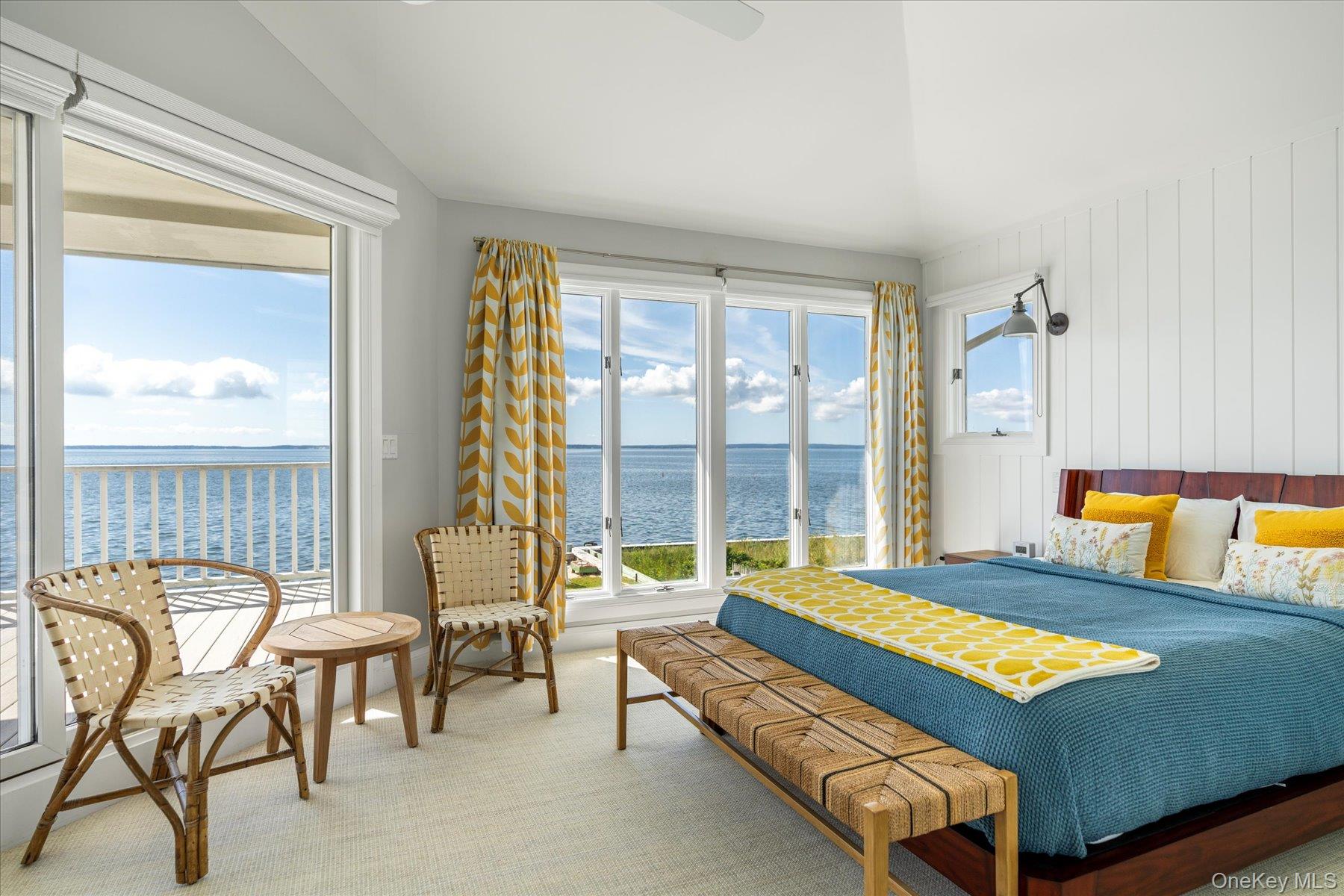 4415 Camp Mineola Road Mattituck, NY 11952 - Photo 23 of 44 Serene primary suite with direct access to a private balcony overlooking the bay.