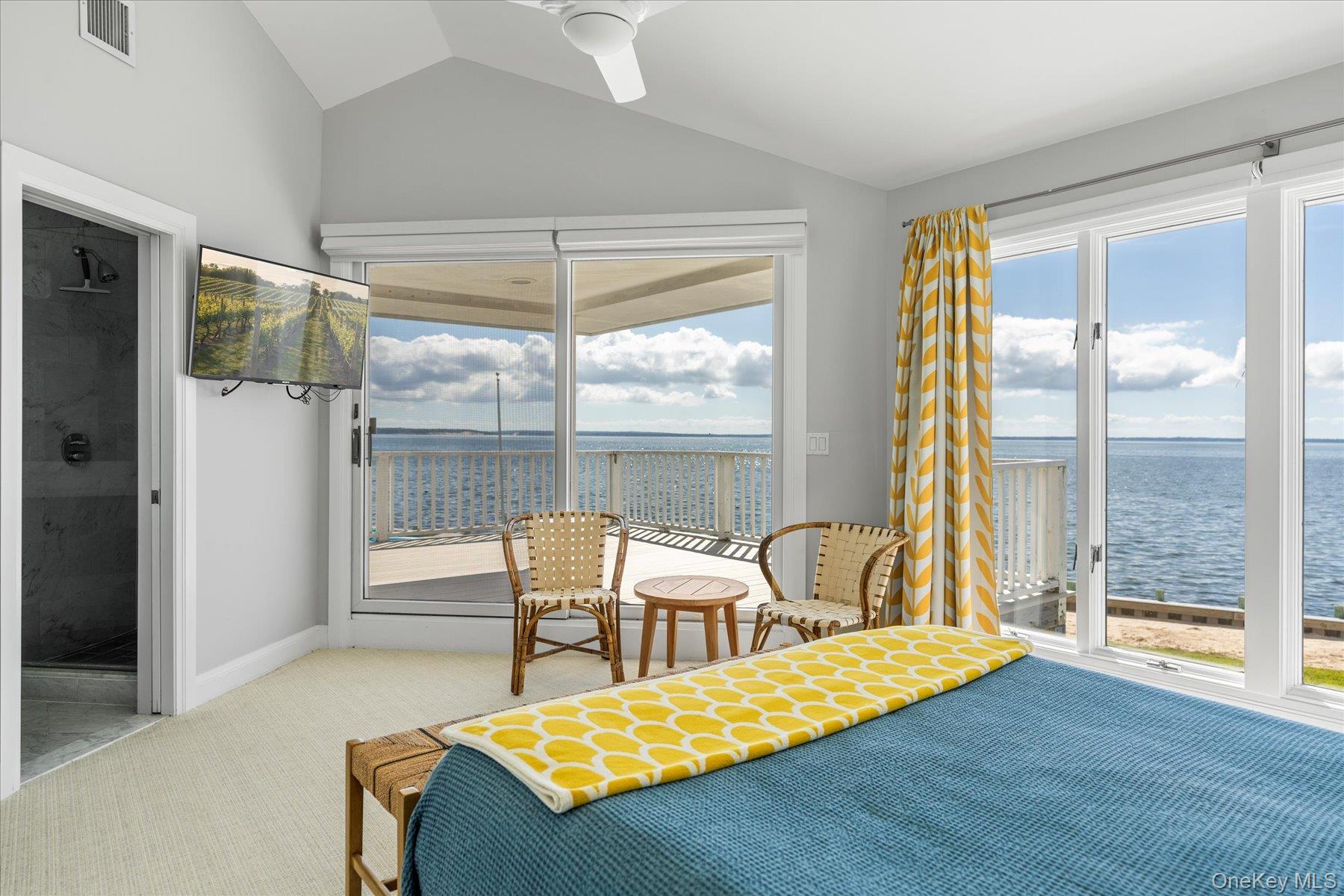 4415 Camp Mineola Road Mattituck, NY 11952 - Photo 25 of 44 Well appointed primary bedroom with modern fixtures and finishes.