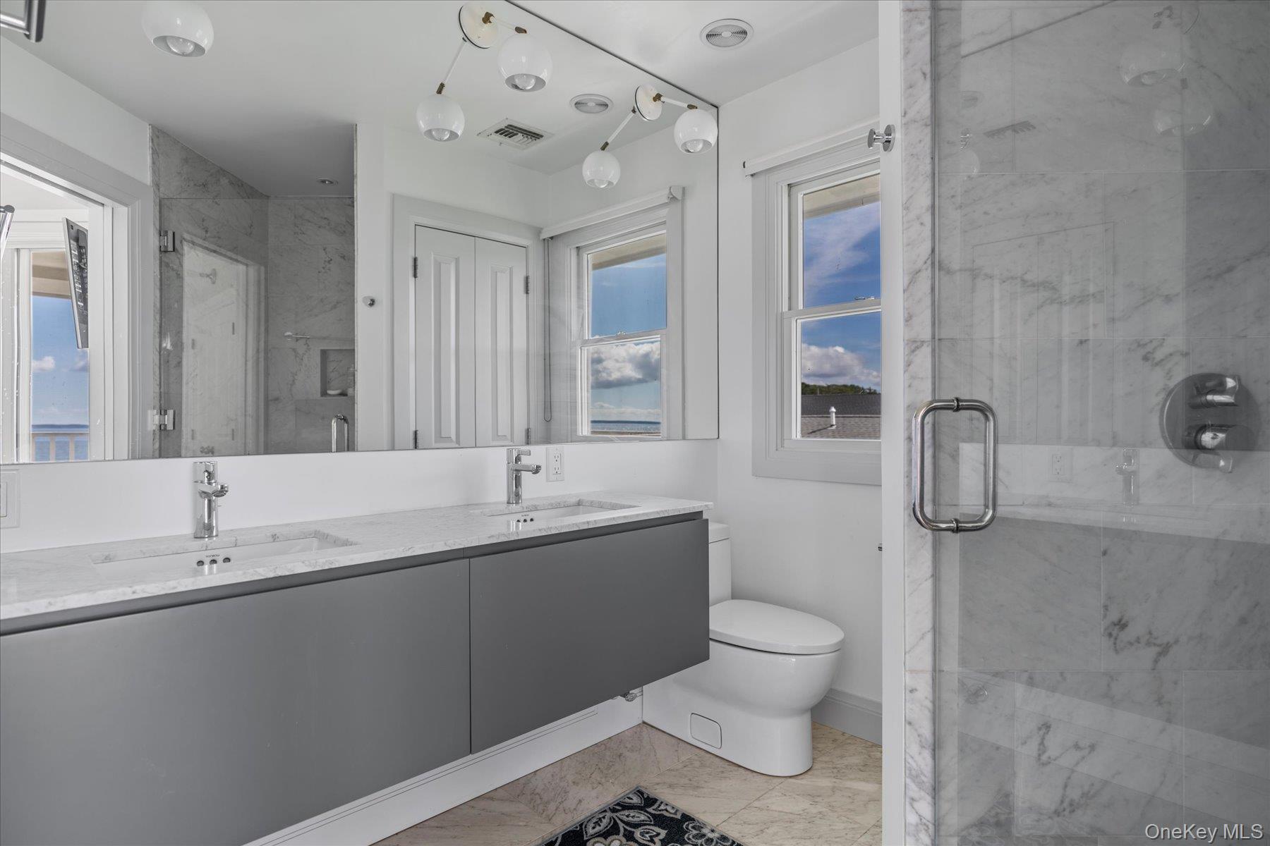 4415 Camp Mineola Road Mattituck, NY 11952 - Photo 26 of 44 Luxurious full bathroom with clean finishes and contemporary design.