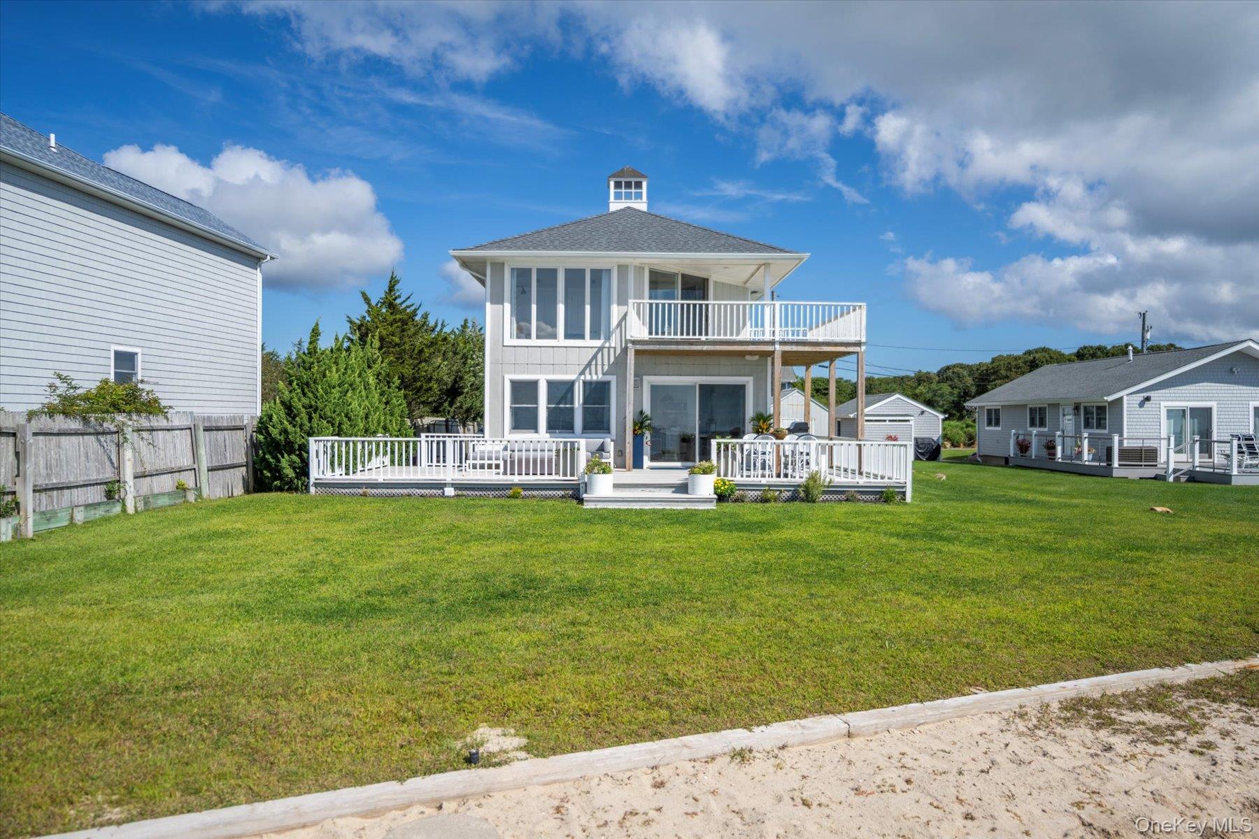 4415 Camp Mineola Road Mattituck, NY 11952 - Photo 6 of 44 Exquisite architecture with recent upgrades including new roof, siding, driveway and gutters.