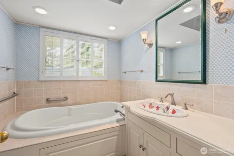 a bathroom with a bathtub and a sink