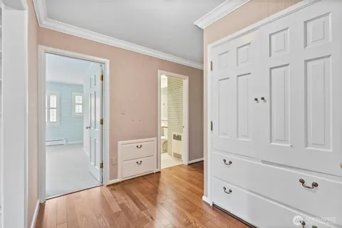 wooden floor with white walls