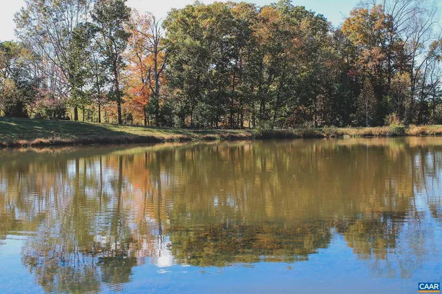 a view of a yard with a lake view