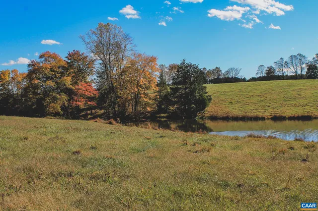 a view of a lake in front of the house